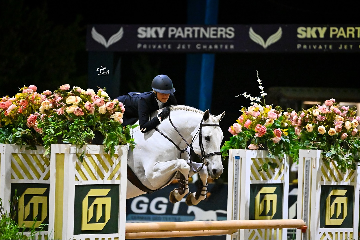 Hunter rider competes with her grey horse at the Sacramento International Horse Show; Photo by Julia B Photography